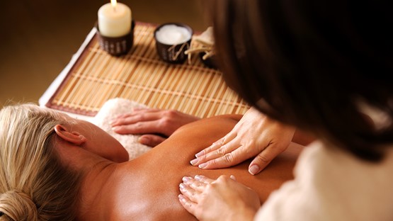 masseur-doing-massaging-backbone-woman-spa-salon.jpg